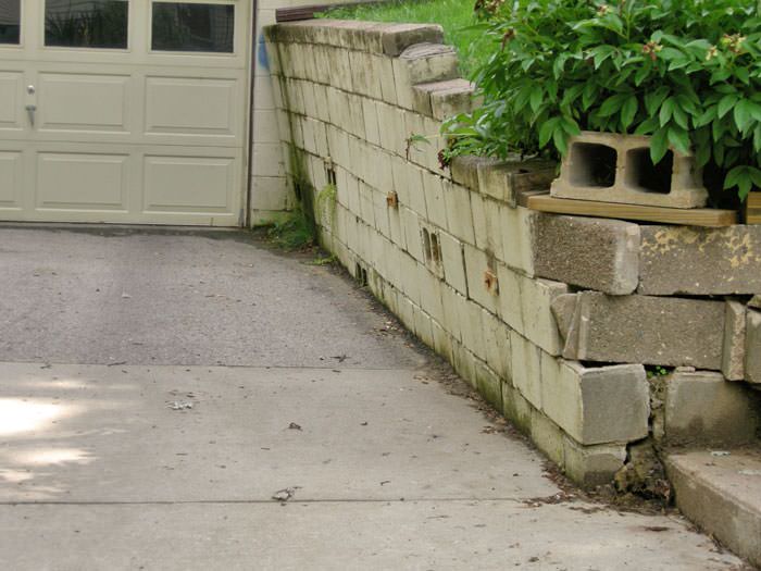Failing Retaining Wall Repair In Nebraska Iowa And Missouri A Failing Retaining Wall Around Driveway In Omaha