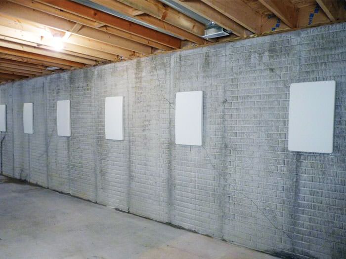 Repairing Straightening Tilting Foundation Walls By Authorized Wall Anchor Covers Installed Along A Foundation That Has Been Straightened In Nebraska City